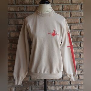 Kacey Musgraves Star-Crossed Unveiled Tour Sweatshirt with Red Graphic Print.